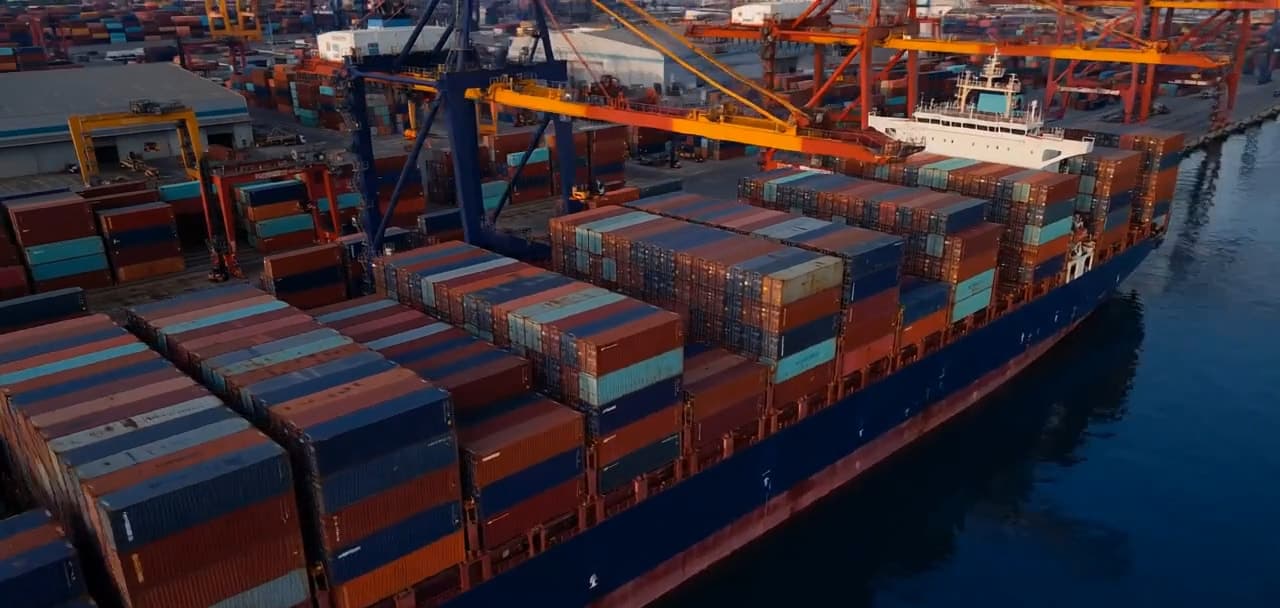A container ship loaded for export at a port